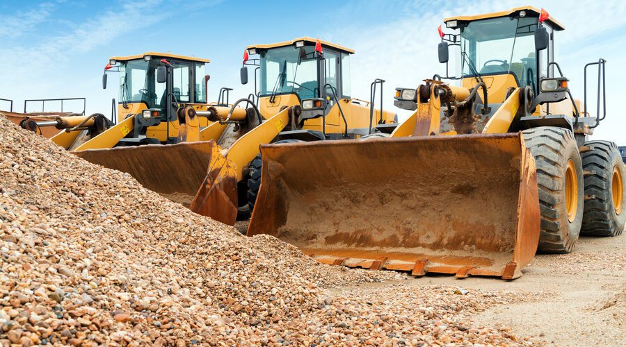 Neatly arranged excavators on site