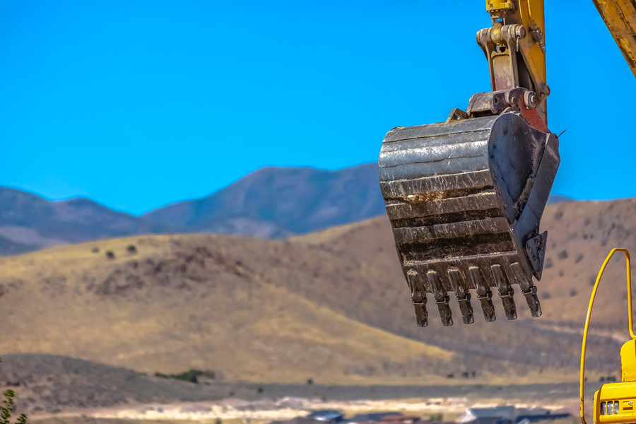 construction equipment with grapple skid steer